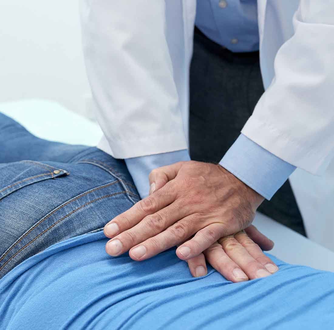 Kinesiology doctor. Sportsmen at the hospital. Man use the teppe